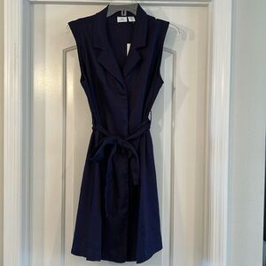 Halston shirt dress with two pockets and fabric belt.